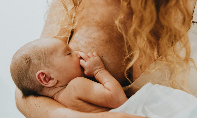 Mom breastfeeding newborn